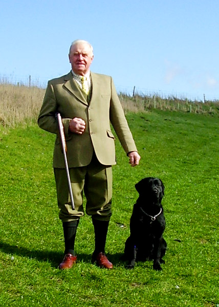 MICK-JACKSON-WITH-HIS-TRUSTY-HOUND-WELCOMING-VISITORS-TO-THE-MONCKTON-SHOOTING-GROUNDS.JPG